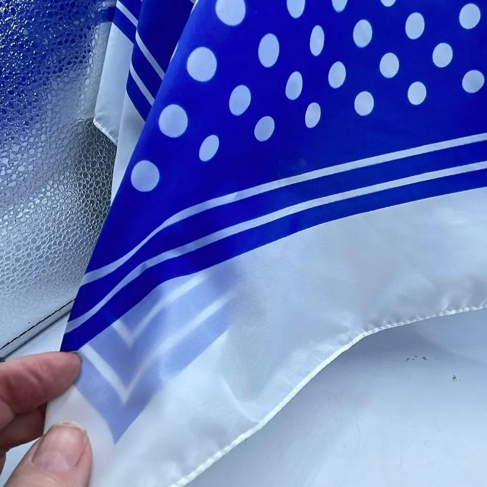 Vintage 26” X27” nylon hand rolled scarf. Water resistant.